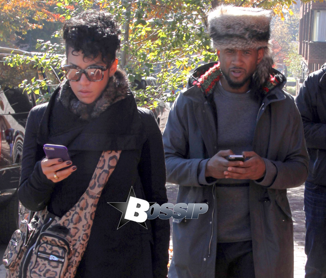 Singer Usher takes a morning stroll in Georgetown with his girlfriend Grace Miguel on November 11, 2014 in Washington, D.C. Usher may be trying to relive the excitment of finding a prize at the bottom of a cereal box. His new single "Clueless" will only be available to download off boxes of specially marked Honey Nut Cheerios at Walmart stores across the country.
