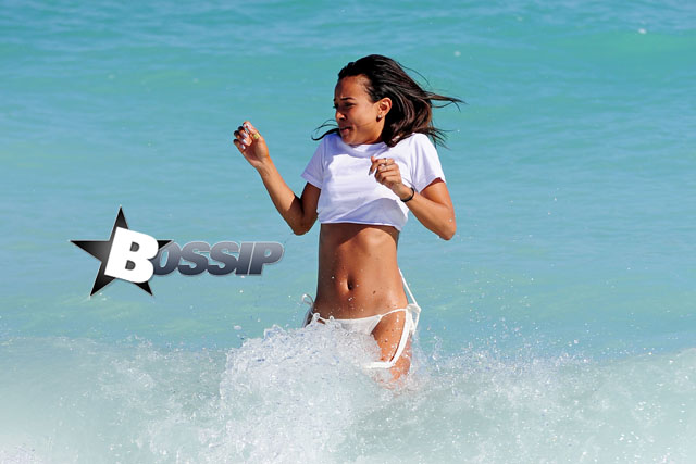 Karrueche Tran forgets about Chris Brown with a fun and relaxing trip to the beach in Miami with a couple of friends. The brunette beauty showed off her amazing beach body wearing a white bikini with a white crop top.