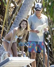 Actress Jessica Alba shows off her bikini body while enjoying a Caribbean vacation with her husband Cash Warren and their children on March 26, 2015.