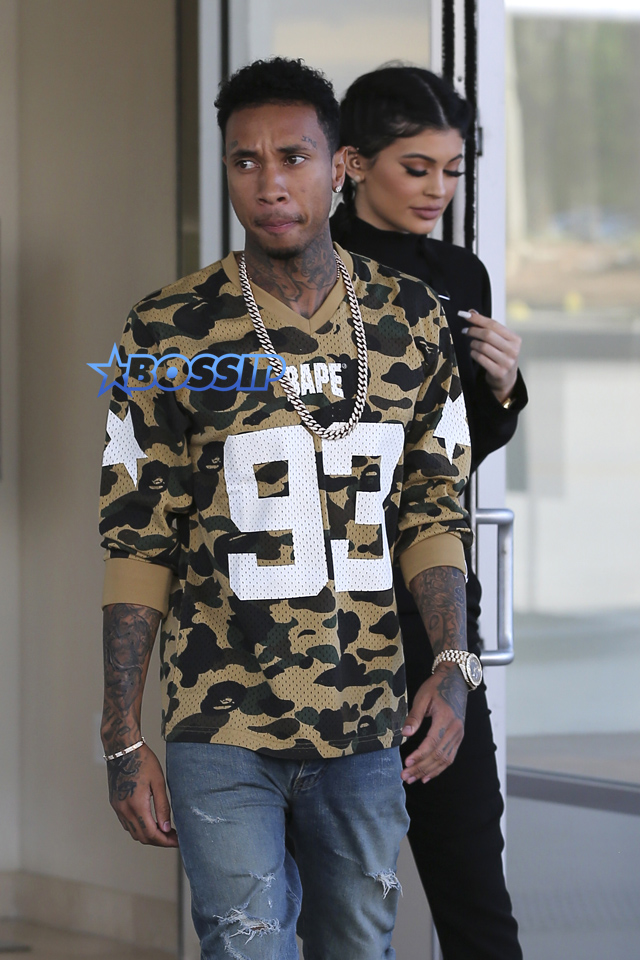 AKM-GSI Kylie Jenner Tyga opens doors westfield shopping center canoga park black overalls camp bape jersey coupled up