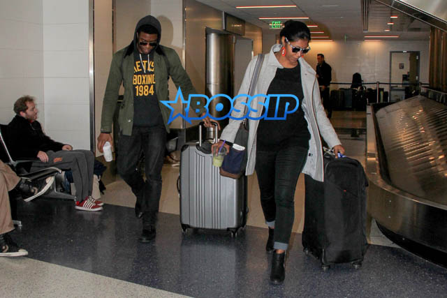 AKM GSI Chadwick Boseman female friend arrive at LAX