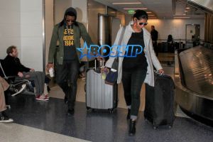 AKM GSI Chadwick Boseman female friend arrive at LAX