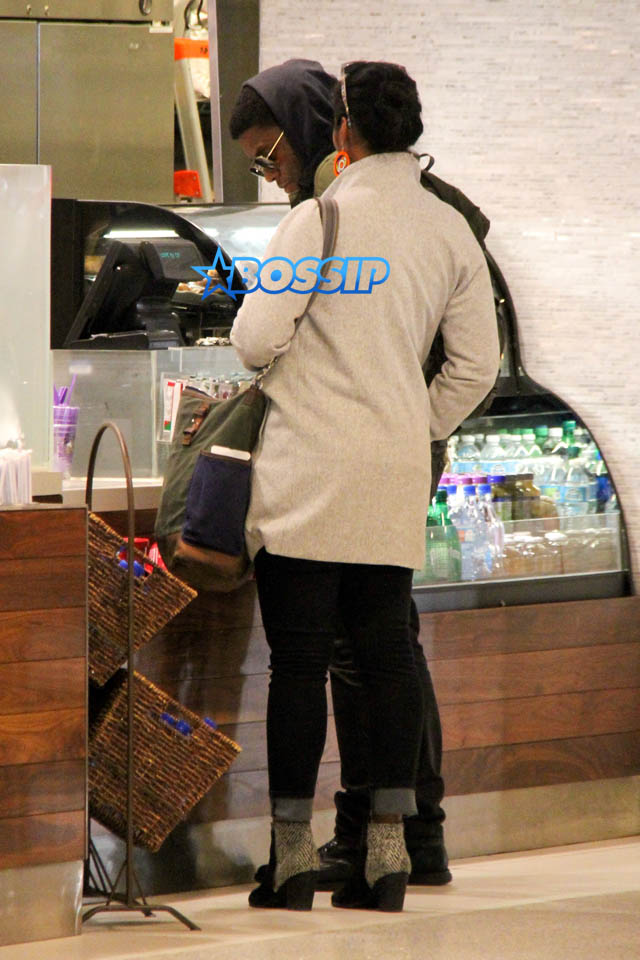 AKM GSI Chadwick Boseman female friend arrive at LAX