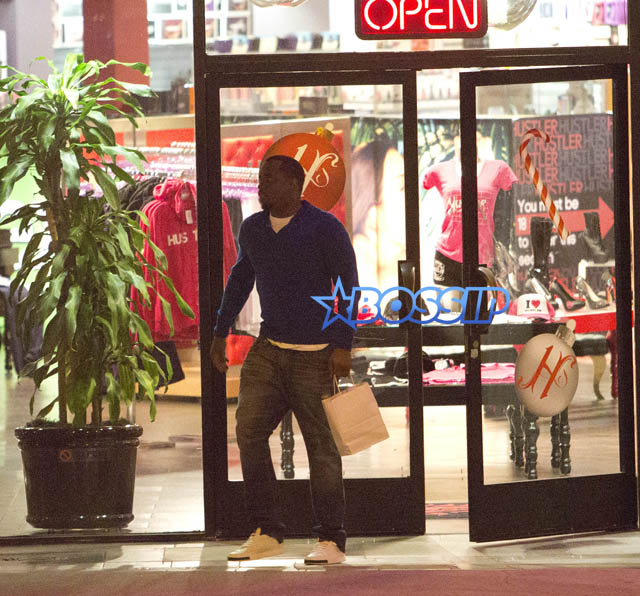 SplashNews Sean Combs &Kim Porter Shop At The Hustler Store