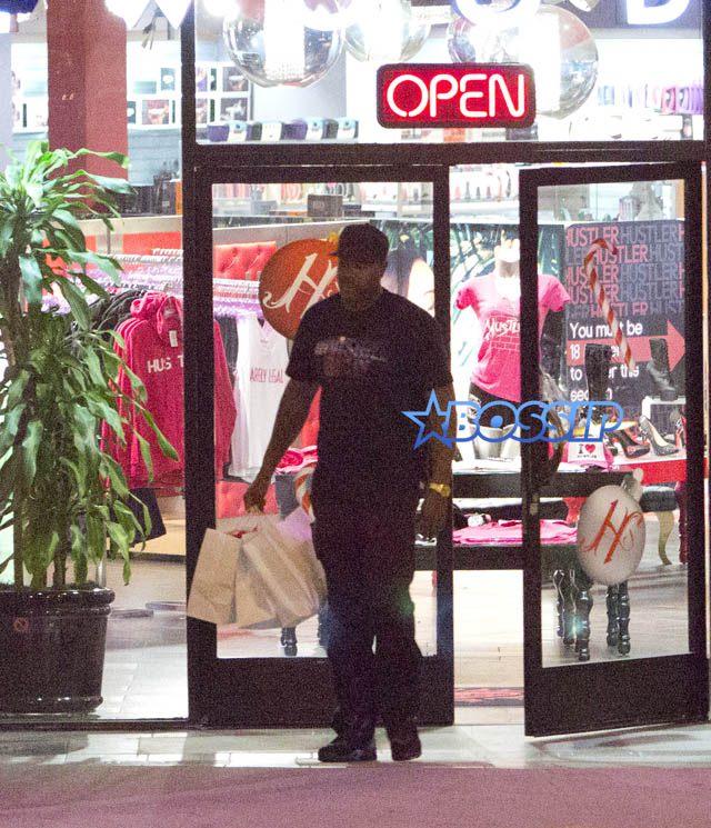 SplashNews Sean Combs &Kim Porter Shop At The Hustler Store