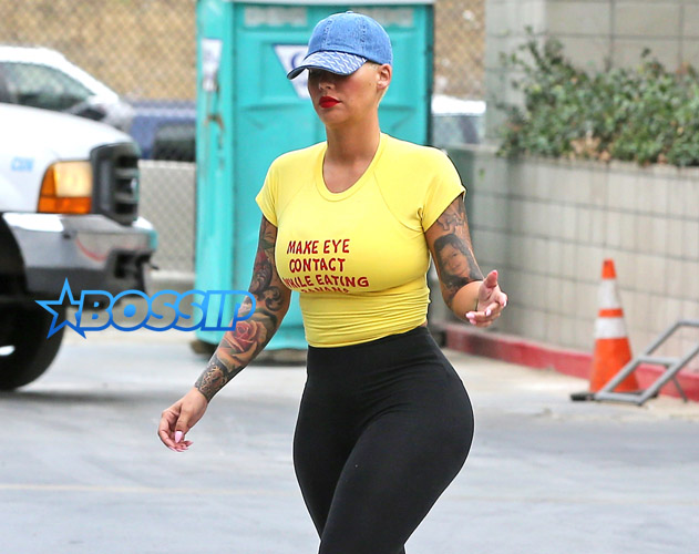 FameFlynetPictures Amber Rose hips gym yellow tee day of Kanye Beef 1/27 yellow shirt make eye contact while eating a banana