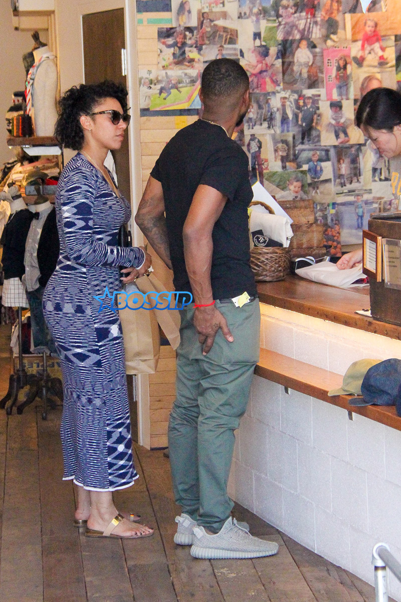 AKM-GSI  wife Grace Miguel and Usher shop for children's clothes at Trico Field in Beverly Hills