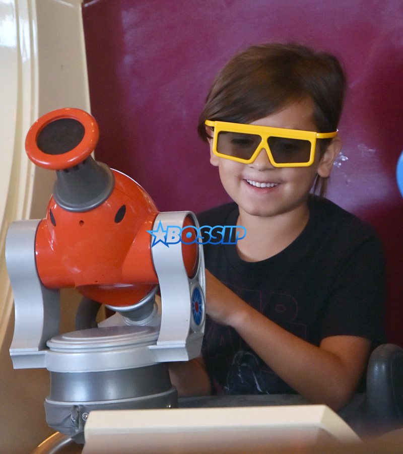 SplashNews Mason Disick is seen wearing 3D glasses as he rides Toy Story Midway Mania at Disney's California Adventure.