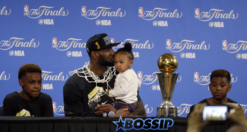 Cleveland Cavaliers' LeBron James answers questions as he holds his daughter Zhuri during a post-game press conference after Game 7 of basketball's NBA Finals Sunday, June 19, 2016, in Oakland, Calif. Cleveland won 93-89. (AP Photo/Eric Rosberg) Zhuri Nova Bryce Maximus Lebron Jr