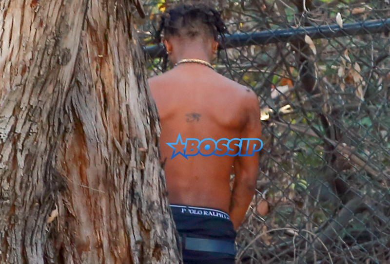 Rapper Slim Jimmy steps out of his limo to pee on the side of the road in Los Angeles, California on June 7, 2016. Slim, who had no shirt on, peed behind a tree. FameFlynet, Inc -