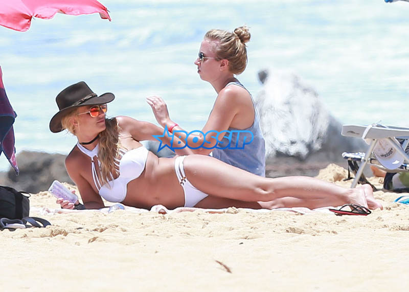 Kauai, HI Britney Spears vacation Hawaii scrappy white bikini, hot pink shorts cowboy hat toned body beach kids played sand FameFlynet/AKM-GSI