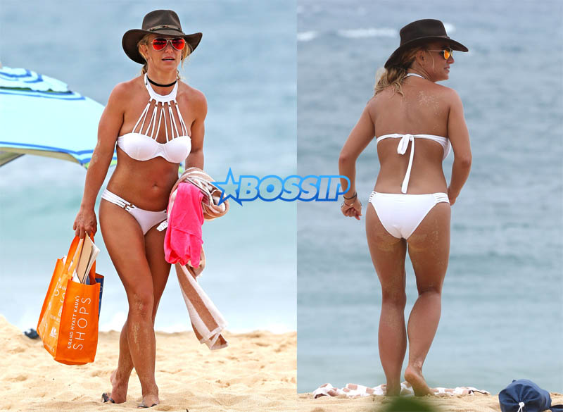 Kauai, HI Britney Spears vacation Hawaii scrappy white bikini, hot pink shorts cowboy hat toned body beach kids played sand FameFlynet/AKM-GSI