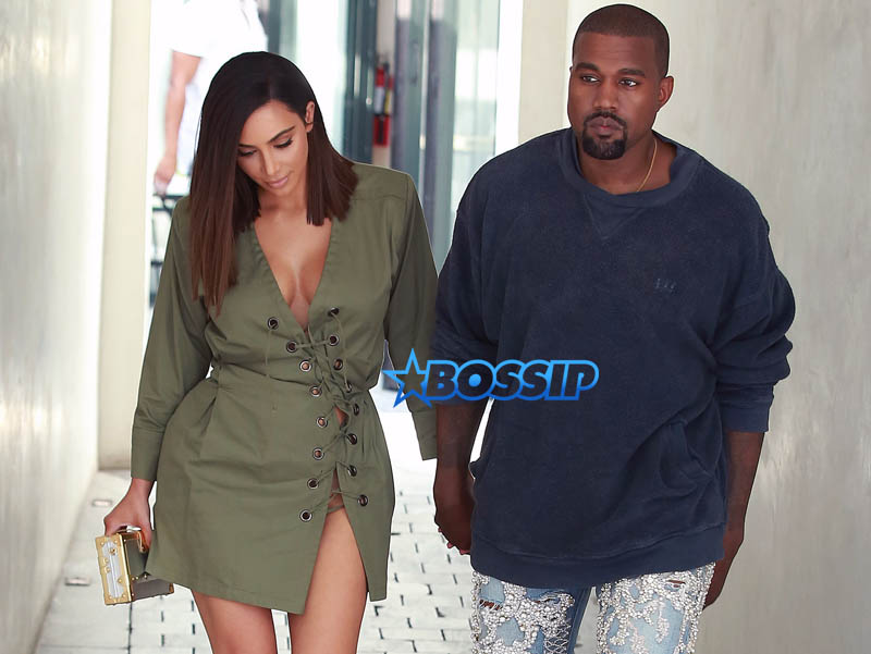 Kanye West Kim Kardashian at Ysabel restaurant in West Hollywood on July 31, 2016. short army green lace up dress Louis Vuitton purse The Petite Metallic. FameFlynet