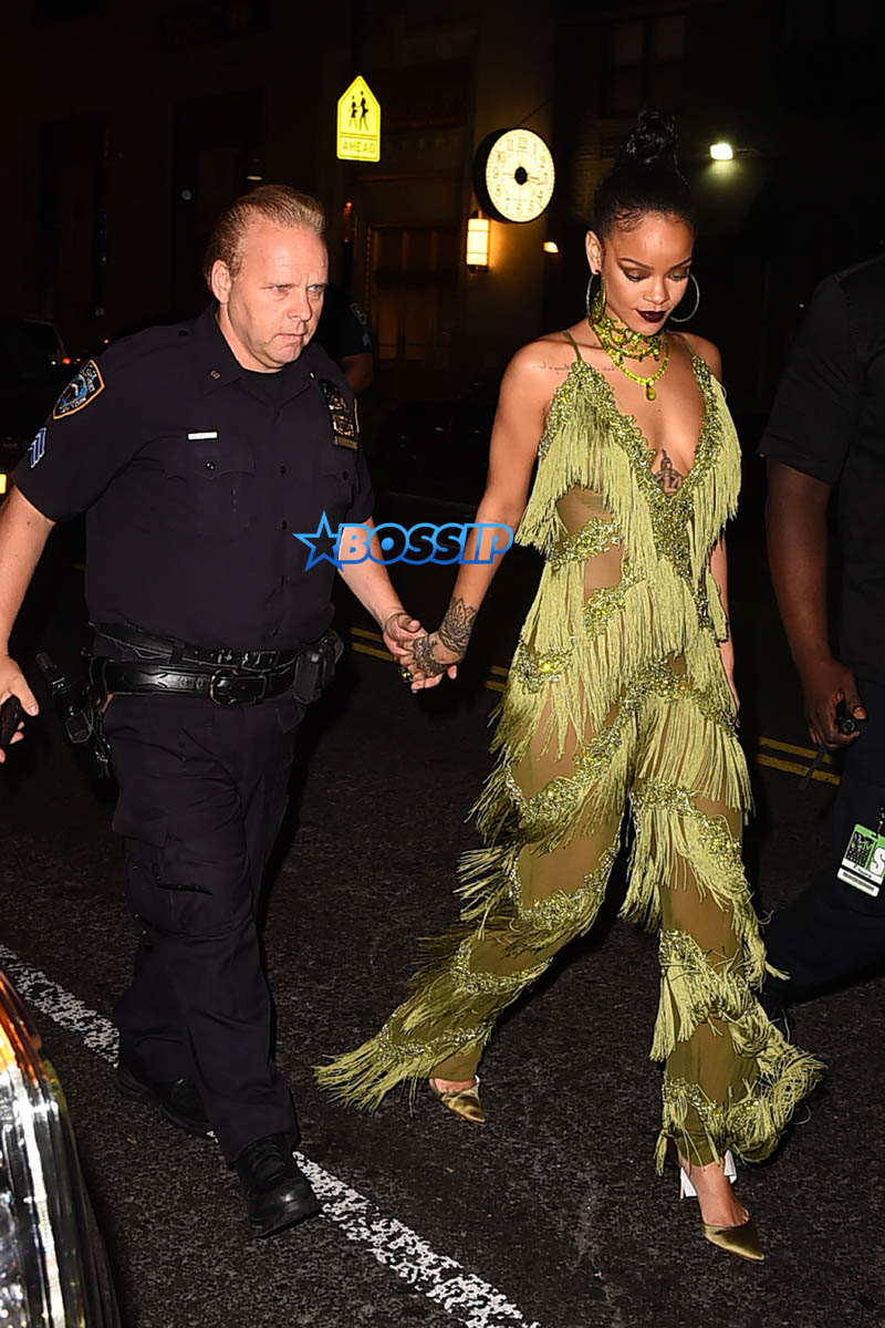 AKM-GSI Rihanna Drake Up and Down after MTV Video Music Awards where she won the Video Vanguard award green fringe jumpsuit