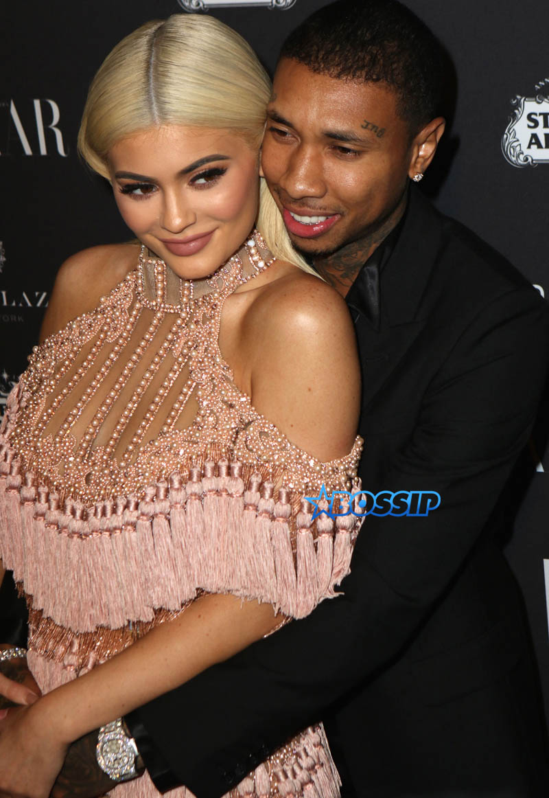 Kylie Jenner Tyga pink dress blonde hair happy coupled up Harper's Bazaar Celebrates "ICONS By Carine Roitfeld" at The Plaza Hotel in New York City. SplashNews