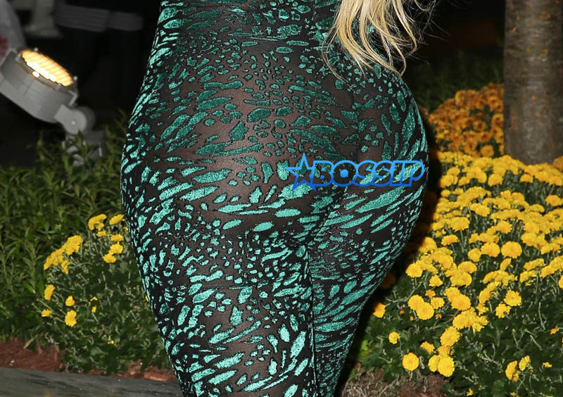 London "Deelishis" Charles poses in sheer green catsuit outside Sirius XM in NYC AKM-GSI