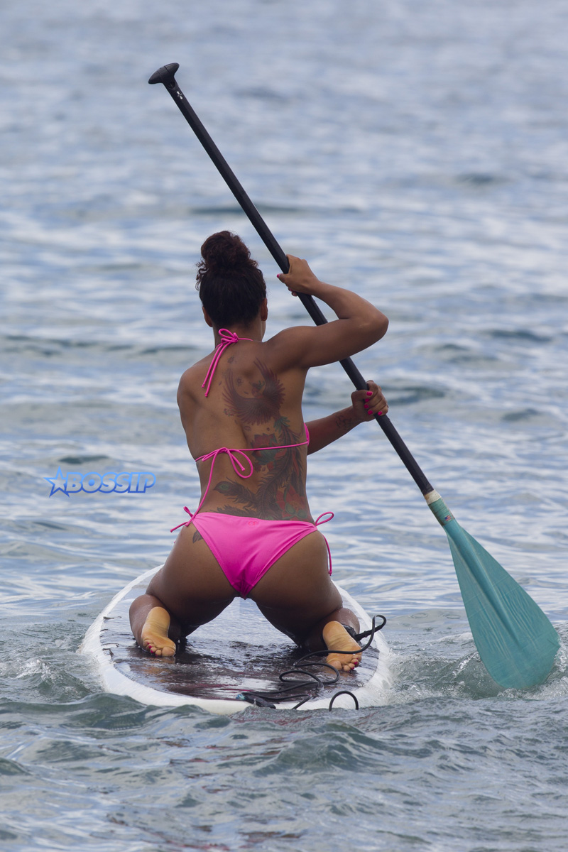 Usher and friends paddle boarding in Maui SplashNews