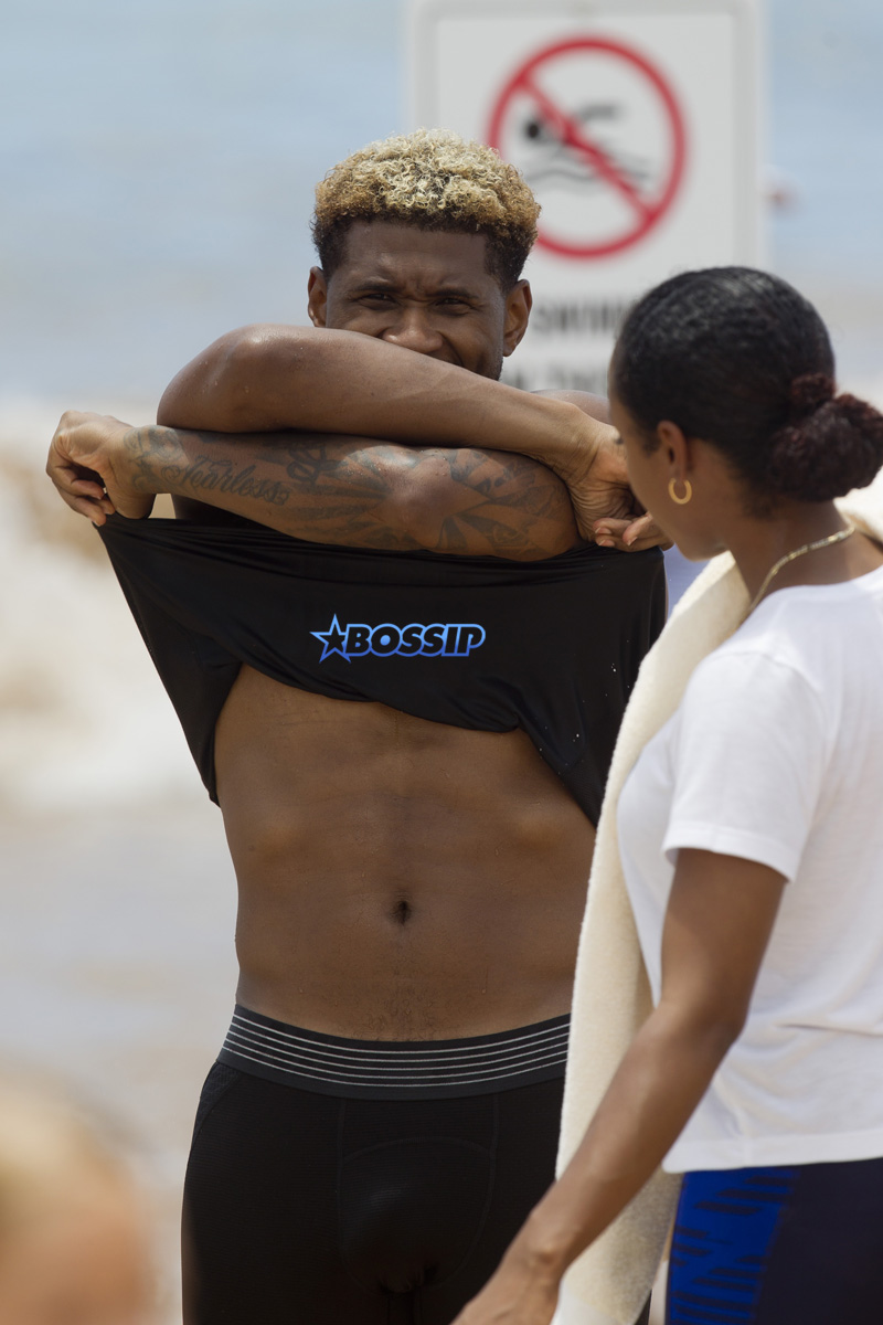 Usher and friends paddle boarding in Maui SplashNews