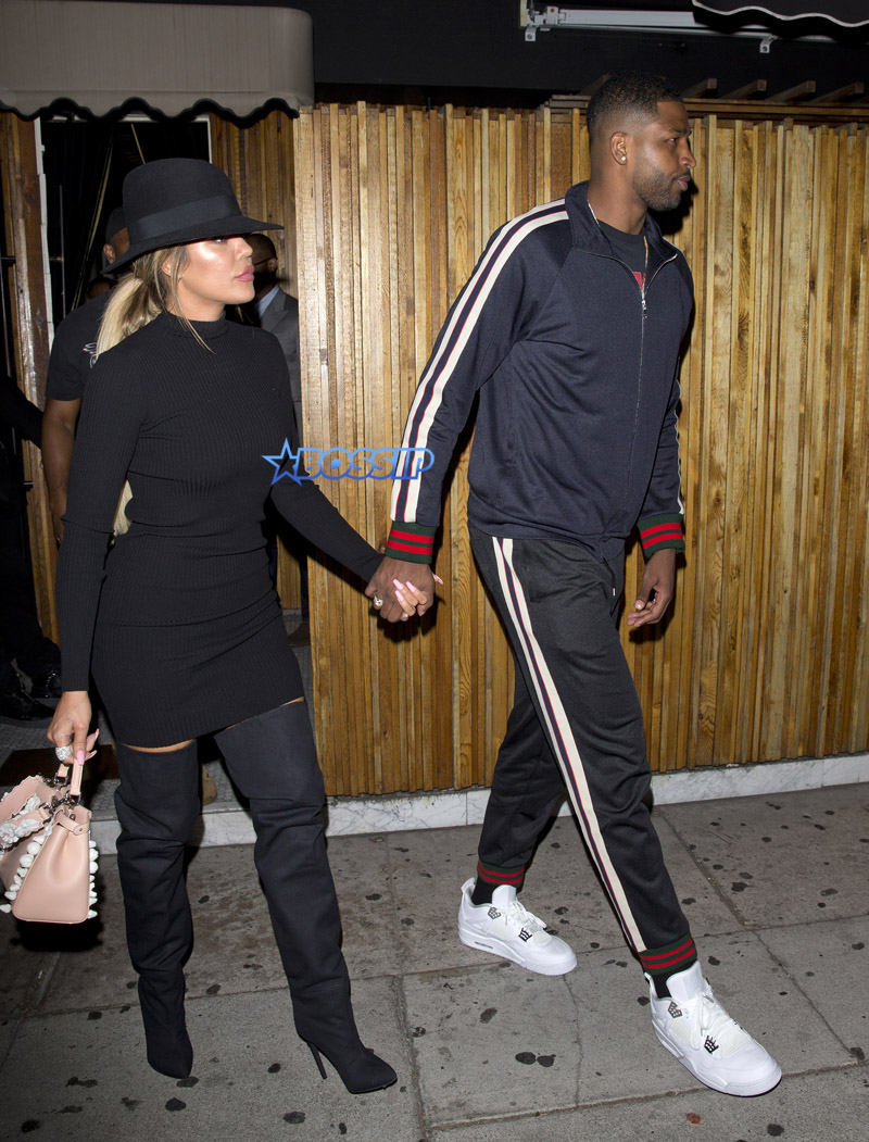 Khloe Kardashian a short black dress, knee high boots and a black hat was NBA Basketball player boyfriend Tristan Thompson 'The Nice Guy' bar in West Hollywood, CA   SPW / Splash News
