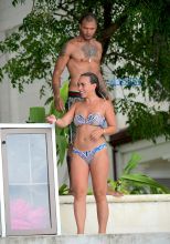 Topshop Heiress Chloe Green and her new boyfriend, "Hot Felon" Jeremy Meeks were spotted enjoying their holiday in Barbados on Saturday. The loved up couple took a wild ride on a Jetski in the light blue Caribbean waters . Afterwards they washed off in the shower together . Meeks showed off his tattoos as he wore a Gucci swimsuit