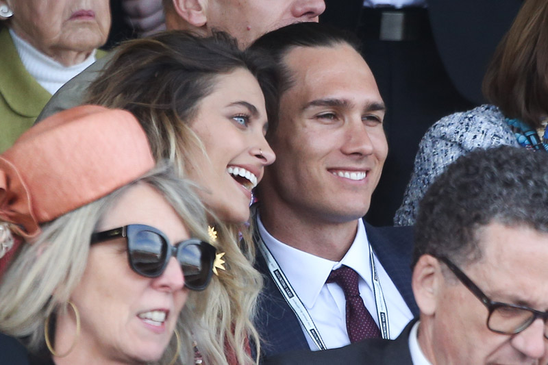 Paris Jackson is seen flirting with an unknown man at the Melbourne Cup.