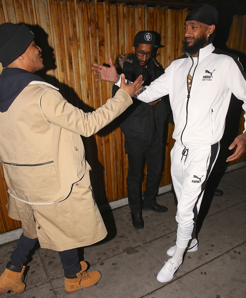 Rapper T.i arrives to nice guy. To celebrate with nipsey hussle. for his new album release party.