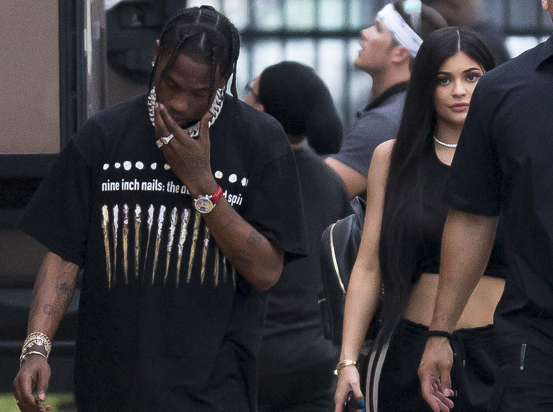 Kylie Jenner and Travis Scott visit DJ Khalid video shoot and go for dinner at Miami Finga Licking fried food restaurant, Miami. The couple where keen to hide from photographers and seemed the help of an armed guard at the fast food stop. It was unclear if Scott was due to film on set but only spent a short time before heading off on the 30 minute drive to a locals strip mall fast food restaurant.