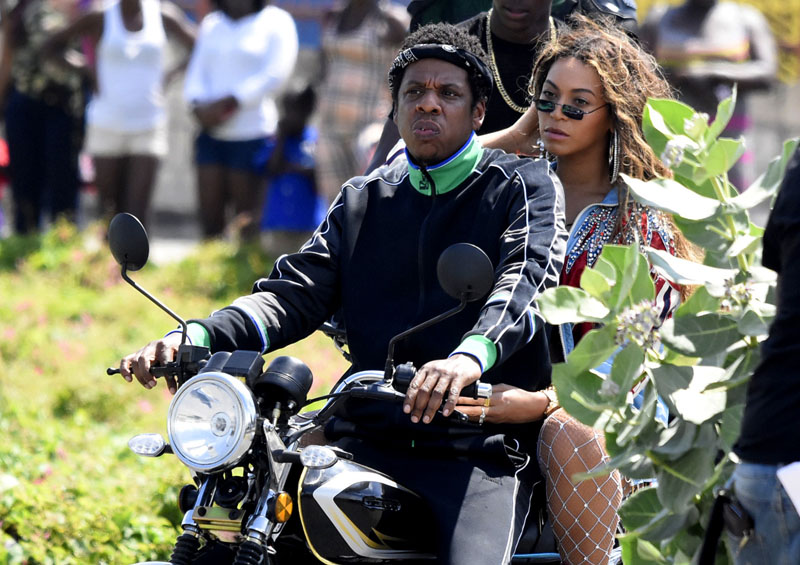 Beyonce Jay Z The superstar couple, who recently announced a joint tour, appear to be shooting a video for a collaboration, in one of the most famous poor neighbourhoods in the world. The pair can be seen looking as cool as ever as they ride a motorcycle through Trench Town, a Kingston district famous as much for its poverty as for being the breeding ground for Reggae stars such as Bob Marley. Beyonce at one point can be seen waving and blowing kisses.