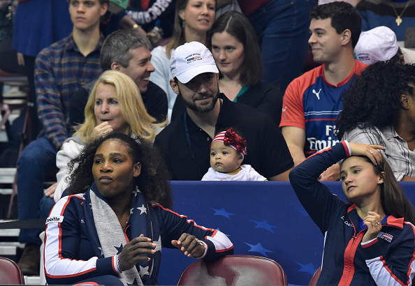 ASHEVILLE, NC - FEBRUARY 10: Serena Williams of Team USA, bottom left, along with her husband Alexis Ohanian and their daughter Alexis Olympia, center, watch the action during the first round of the 2018 Fed Cup at US Cellular Center on February 10, 2018 in Asheville, North Carolina.