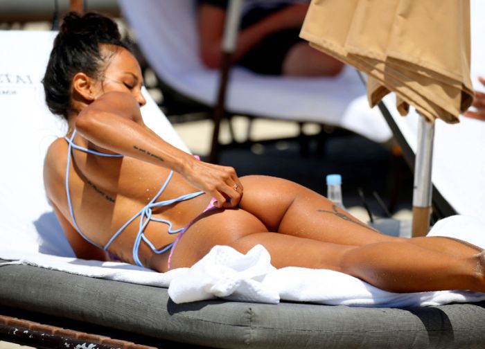 Karrueche Tran and her boyfriend NFL free agent Victor Cruz are seen during a beach day in Miami. Karrueche Tran was seen wearing a small golden necklace with her name written on it. The 29 year old actress has been filming her TNT show Claws.