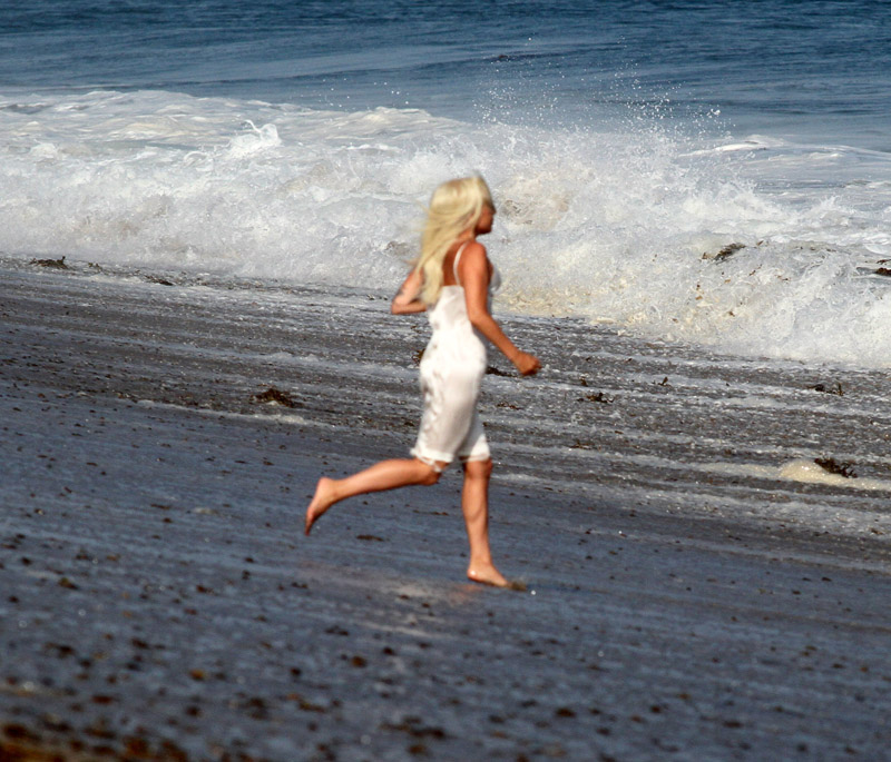 Lady Gaga topless wearing a bikini and thong lingerie for a photoshoot on the beach in Malibu California. The wet and wild photographers and crew got soaked by the big waves.
