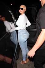 Ace of Diamonds club in Los Angeles, CA. Amber Rose proudly showed off her cleavage and curvy figure as she left the club.