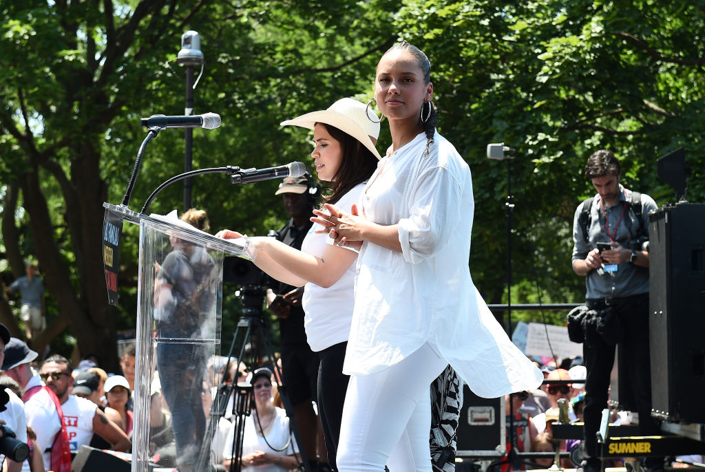 WASHINGTON, DC - JUNE 30: Alicia Keys and America Ferrera speak during Families Belong Together Rally In Washington DC Sponsored By MoveOn, National Domestic Workers Alliance, And Hundreds Of Allies on June 30, 2018 in Washington, DC.