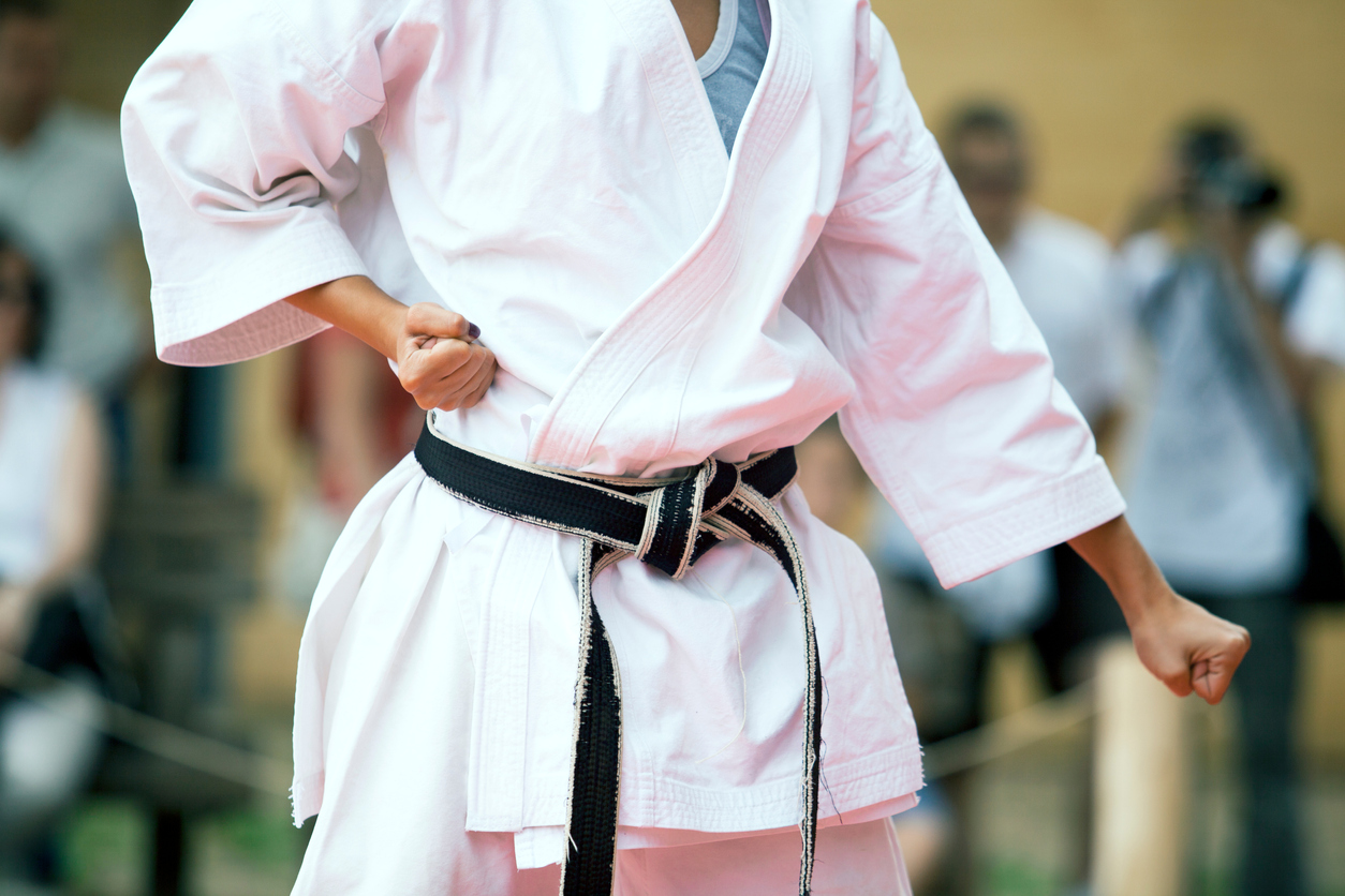 Midsection Of Child Practicing Karate