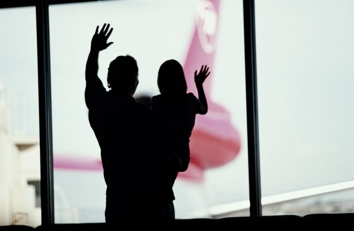 FATHER & DAUGHTER WAVING TO AIRPLANES
