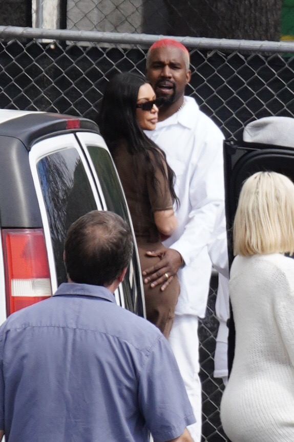 Kanye West Kim Kardashian Kourtney Kardashian and Khloe Kardashian leave his Sunday Service