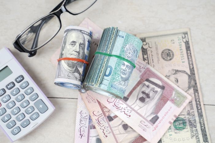 Multiple banknote on wooden table