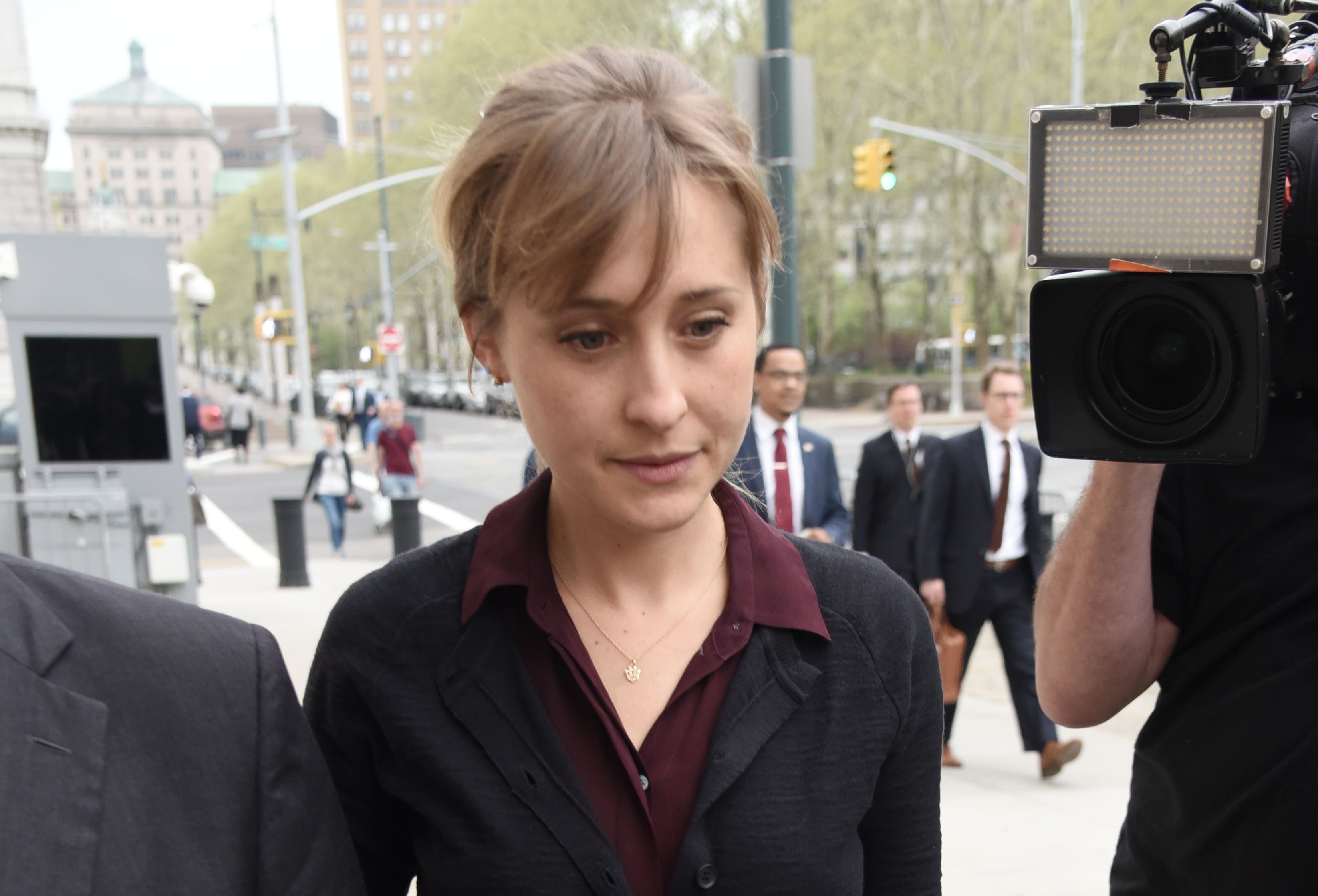 smallville actress allison mack pleads guilty in sex cult case
