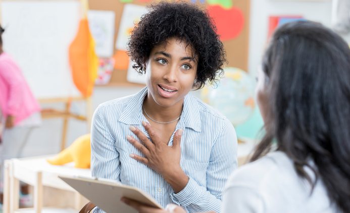 Concerned mom talks with her child's teacher