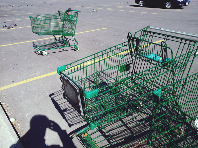 High Angle View Of Shopping Cart On Parking Lot