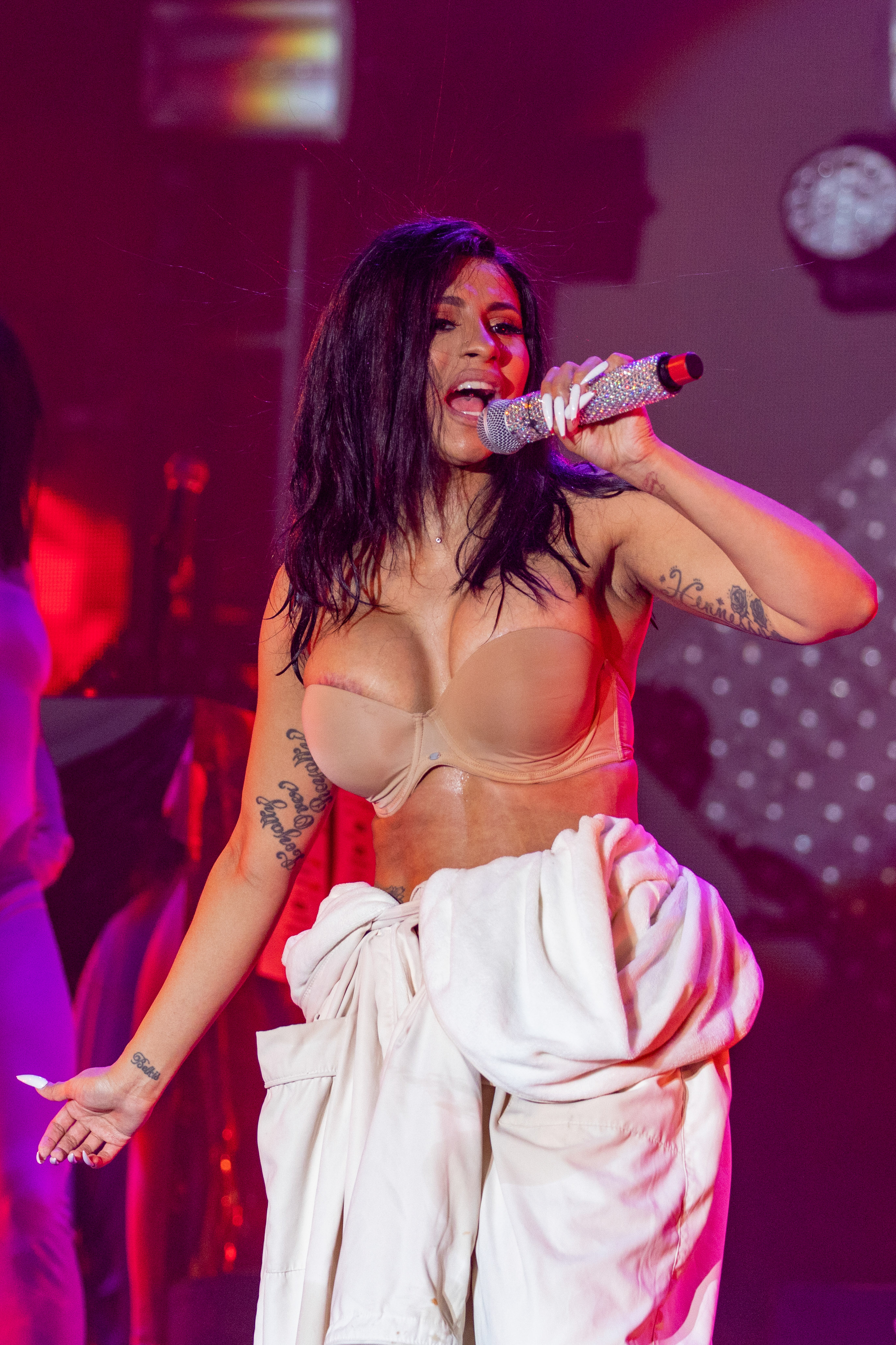 Cardi B Performs in a Bathrobe at Bonaroo after Busting Open Dior Sequined jumpsuit