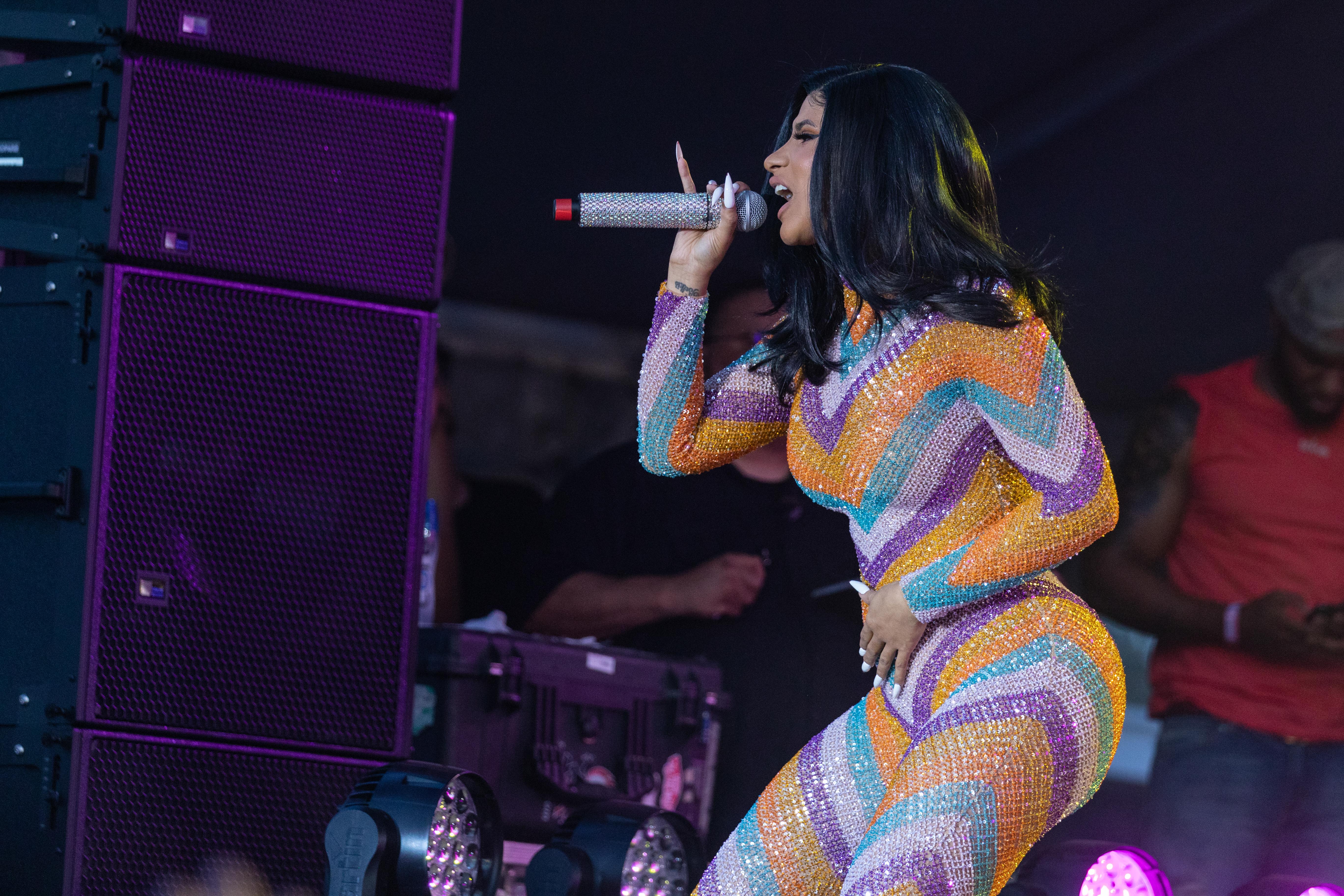 Cardi B Performs in a Bathrobe at Bonaroo after Busting Open Dior Sequined jumpsuit