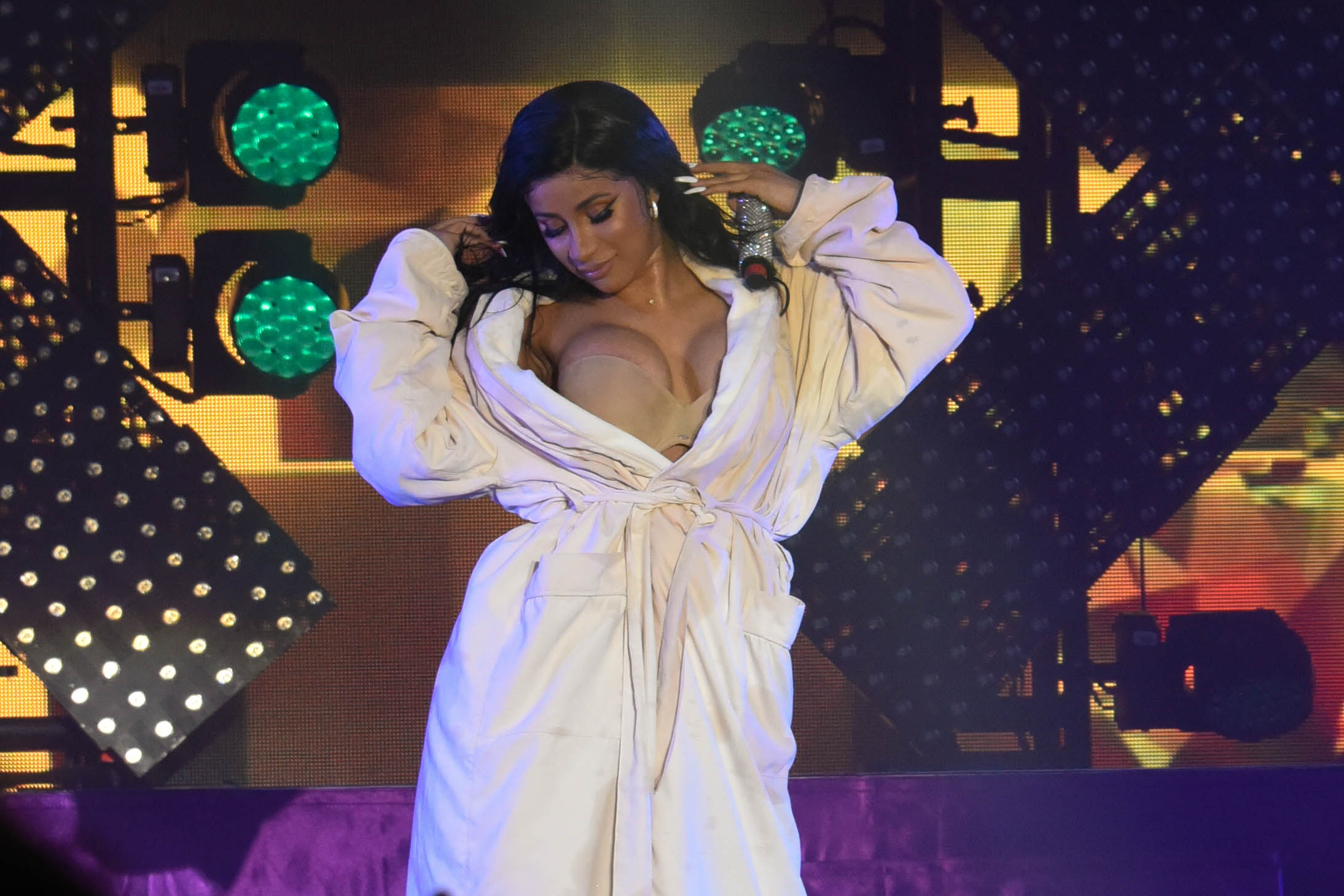 Cardi B Performs in a Bathrobe at Bonaroo after Busting Open Dior Sequined jumpsuit