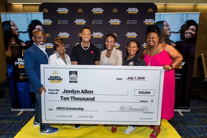 Thurgood Marshall College Fund (TMCF) national ambassador Terrence J presents incoming HBCU freshman Jordyn Allen