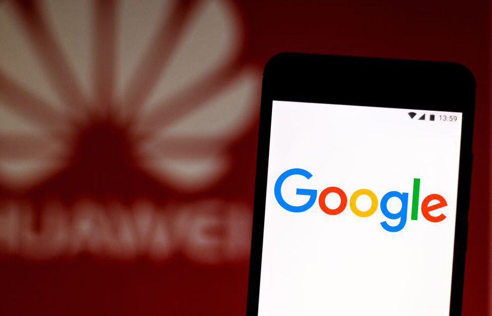 In this photo illustration a Google logo seen displayed on a...
