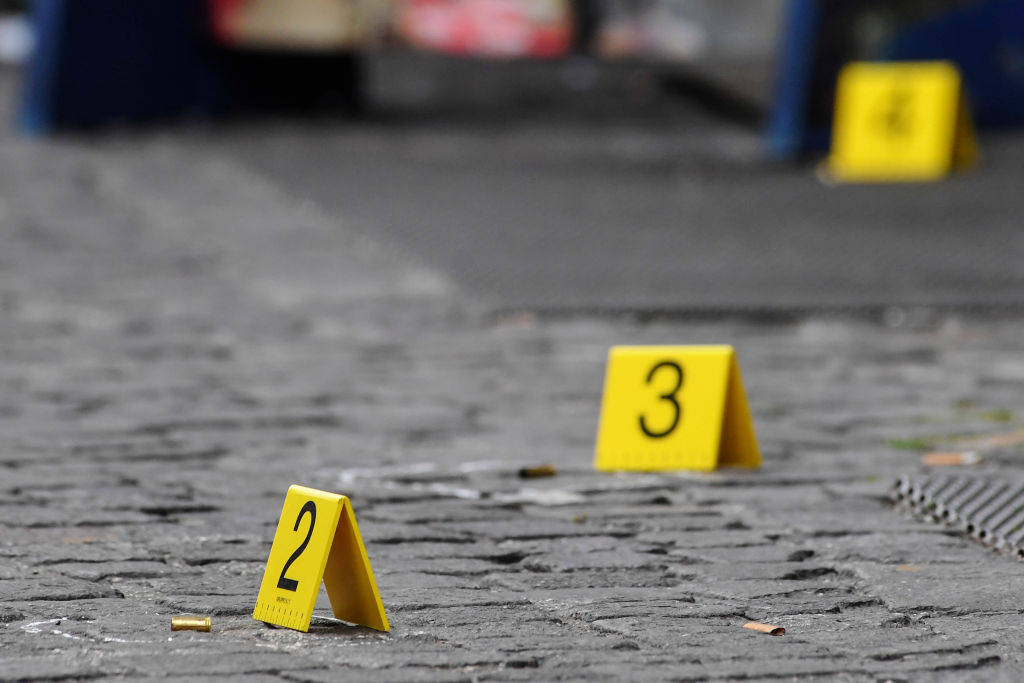 Bullet markers placed by forensic policemen at the crime...