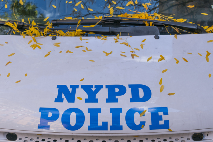 Autumn color fallen leaves on the Police car at New York NY USA on Nov. 13 2018.