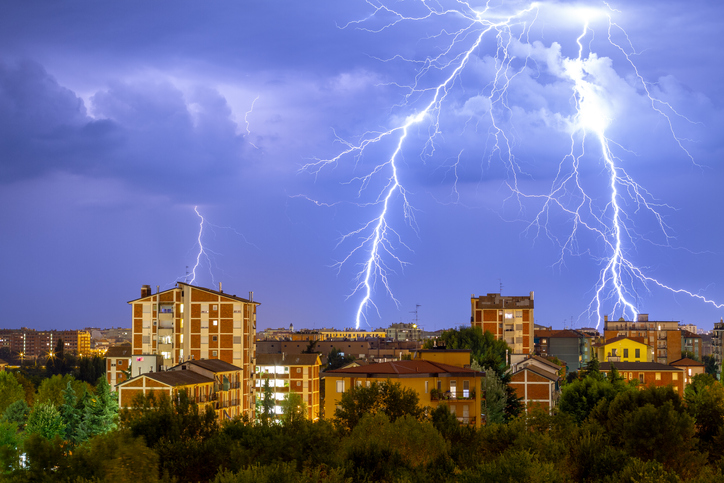 Lightning striking over a city