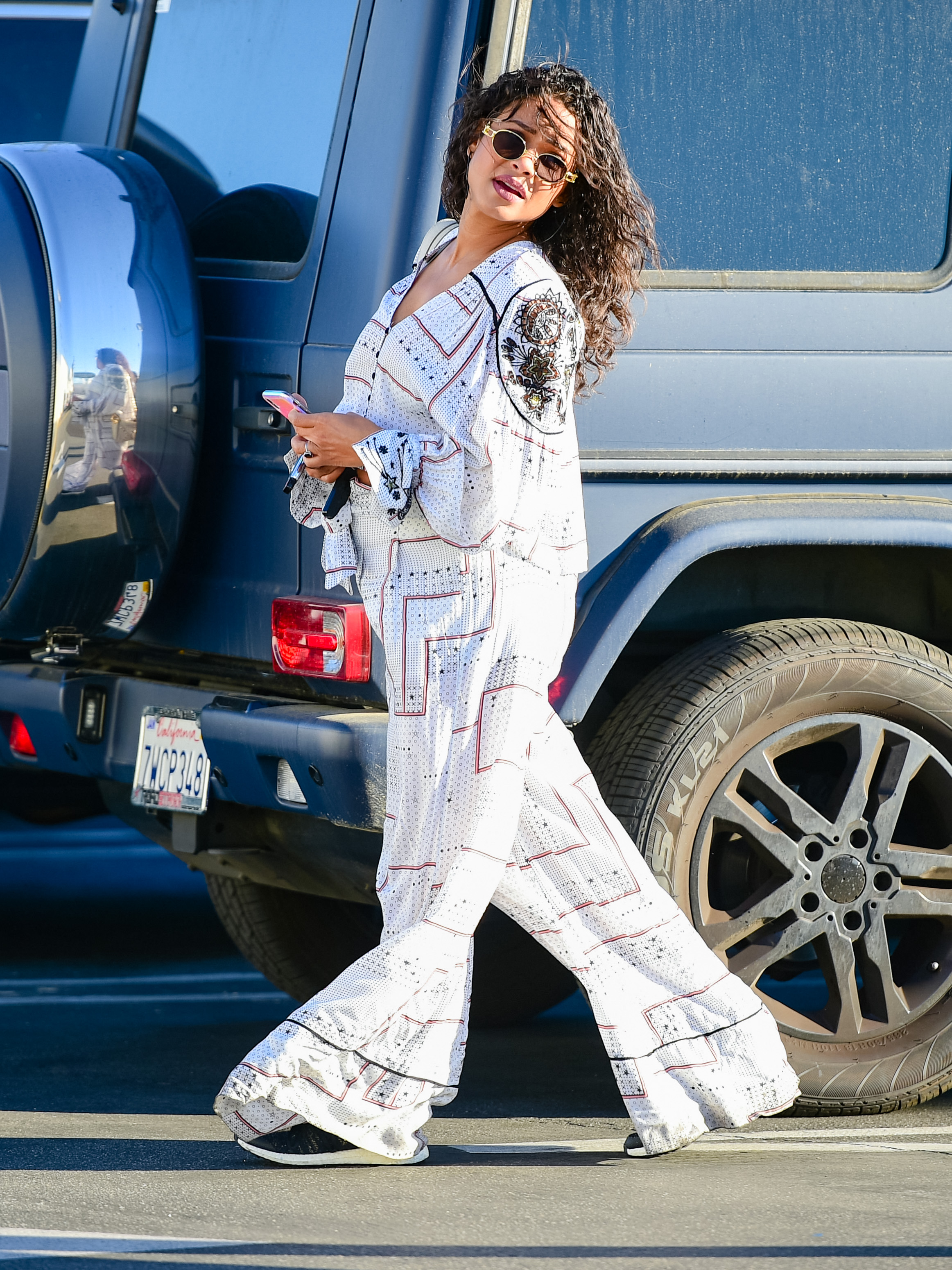 Pregnant Christina Milian wears a billowy maternity set