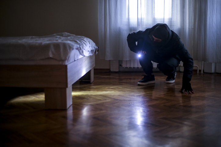 Thief searching for money